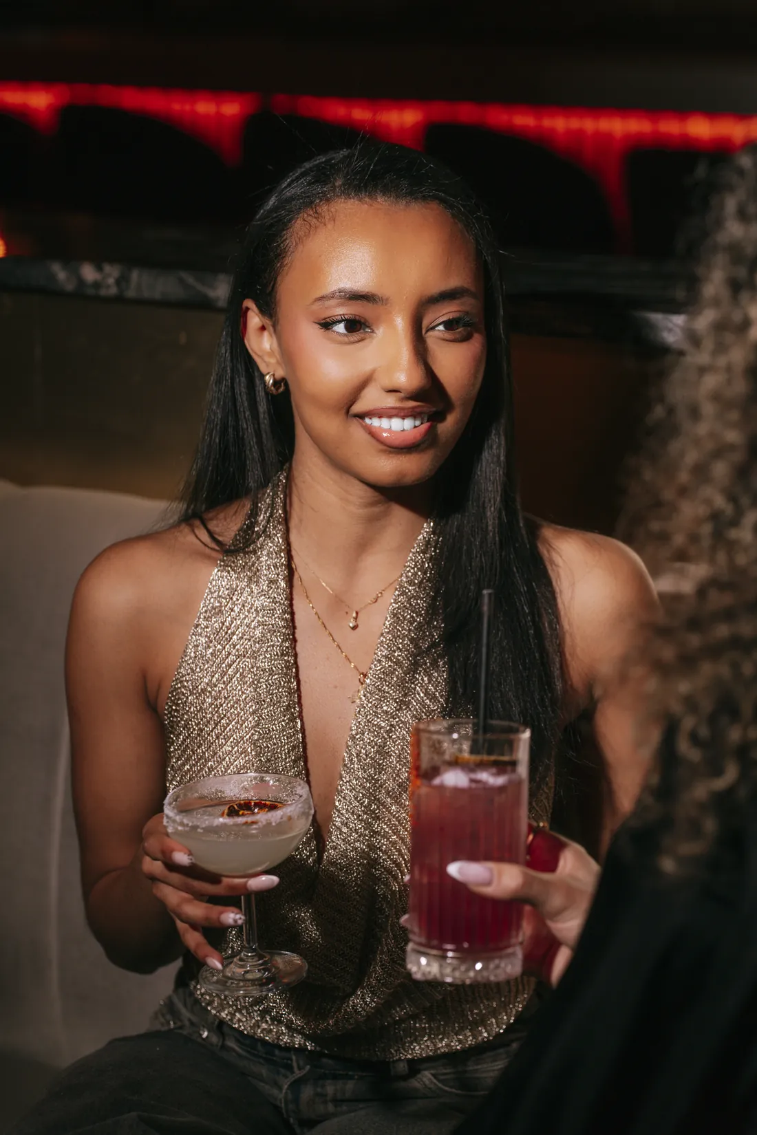 Guest with cocktails in the dining room